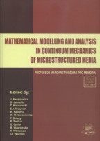 Mathematical modelling and analysis in continuum mechanics of microstructured media